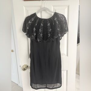 Chic Black Dress with Embroidered Capelet